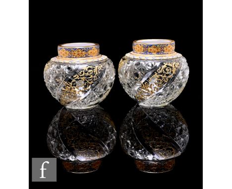 A pair of late 19th Century Moser clear crystal posy vases of compressed ovoid form with collar rim, the pair with wrythen cu