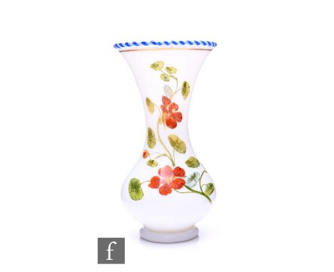 Baccarat - A 19th Century opaline glass vase, circa 1850, of footed baluster form with hot applied torsade blue and white twi