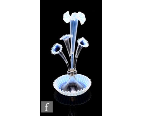 A Victorian glass epergne comprising three flutes and central slender flute on round base, each having graduated opaline to c