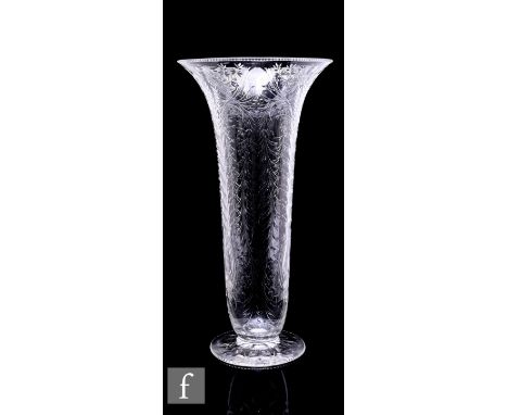 An early 20th Century Stevens &amp; Williams clear crystal vase of footed trumpet form, the body polished intaglio cut with p