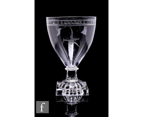 A late Georgian rummer circa 1800, the pointed round funnel bowl with bladed collar above a lemon squeezer foot, the bowl eng