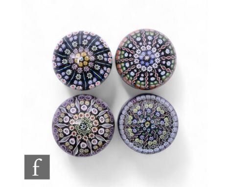 Perthshire - A later 20th Century glass paperweight, of domed form, internally decorated in a cartwheel design comprising of 