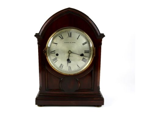 Mappin &amp; Webb mahogany cased mantel clock, the silvered dial with Roman numerals and triple train movement, on squashed b