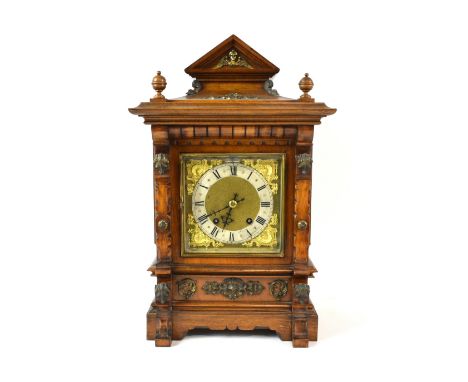 Early 20th century walnut table clock with gilt metal mounts, the two train German movement striking on two gongs. RSM 3916 4