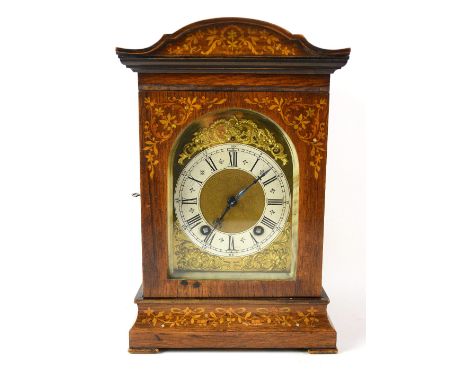 Early 20th century marquetry inlaid mantle clock the eight day movement striking on a gong. 34.5cm and a mahogany balloon clo