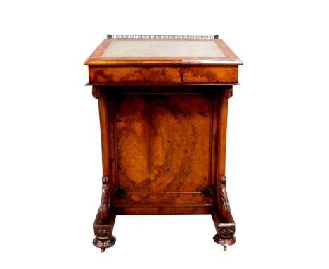 Victorian walnut Davenport, the galleried back lifting up to reveal inkwell, pen tray and stationery compartments, over slope