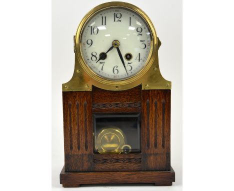 Early 20th century oak and brass cased twin train mantel clock by Philip Hass, 29cm 