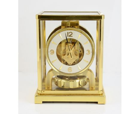 Jaeger Le Coultre Atmos Caliber 526-5 mantle clock, Serial No 145384, the skeleton movement with white enamel chapter ring, b