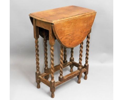 A small oak barley twist gate leg table, 30in high x 23in deep x 34in extended