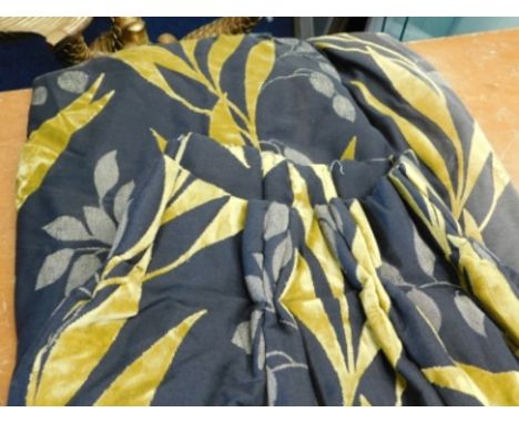 A large pair of heavy lined curtains, each approx. 94in drop x 47in wide at pleats, some fading &amp; sun staining to lining