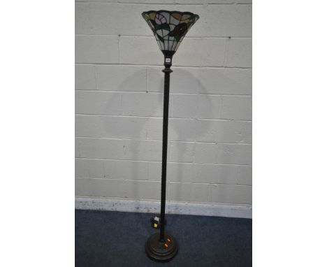A METAL SPIRAL STANDARD LAMP, with a Tiffany style floral shade, overall height 175cm (condition report: general wear)