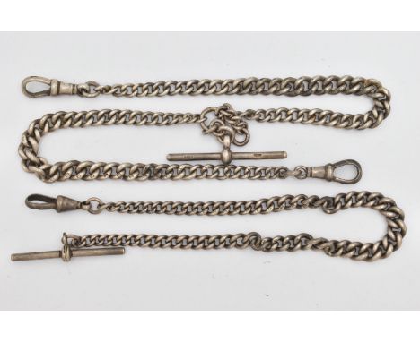 TWO EARLY 20TH CENTURY SILVER ALBERT CHAINS, the first a double Albert chain, with graduating curb links, approximate length 