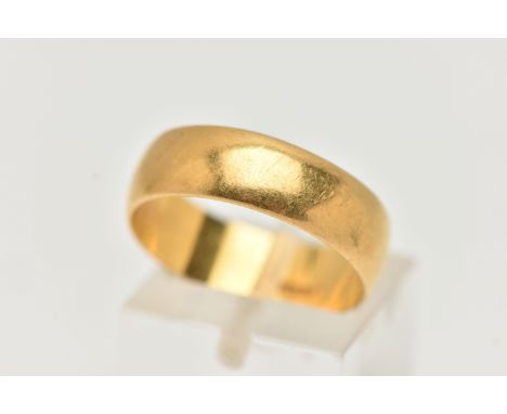 A YELLOW METAL WIDE POLISHED BAND, approximate band width 6.2mm, stamped 22 carat, ring size N, approximate gross weight 5.5 