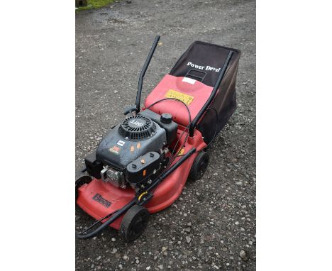 A POWER DEVIL PETROL LAWNMOWER (condition report: engine turns, untested any further, missing bolts to handle)