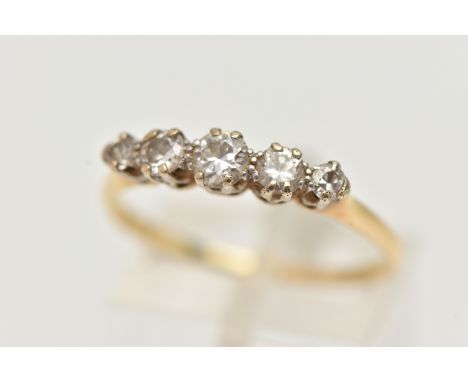 A FIVE STONE DIAMOND RING, designed as a graduated line of brilliant cut diamonds within claw settings, stamp rubbed, believe