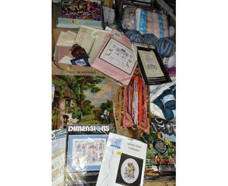 FOUR BOXES OF HABERDASHERY AND NEEDLEWORK ITEMS, including two boxes of wool, a small quantity of patterns and a bag of knitt