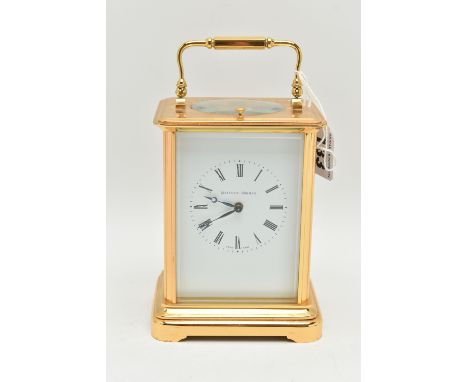 A BRASS 'MATTHEW NORMAN' CARRIAGE CLOCK, with repeat mechanism, white enamel dial,  black Roman numerals, blue steel hands, a