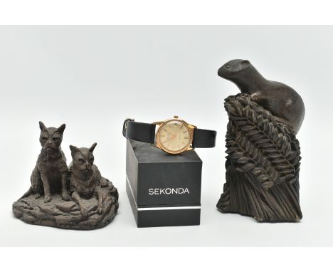 A 'MUDU' WRISTWATCH AND SCULPTURES, an automatic movement, round champagne dial, signed 'MuDu 25 jewels' baton markers, date 
