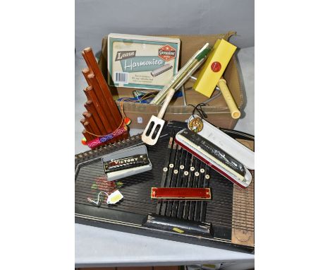 AN EARLY 20TH CENTURY AUTO HARP AND A BOX OF MUSICAL INSTRUMENTS, including a boxed Hero chromatic harmonica, a cased Victory