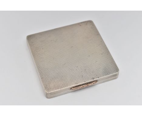 A SILVER 1940S COMPACT, of a square form, engine turned pattern, gilt interior with mirror, hallmarked 'L E McCann' Birmingha