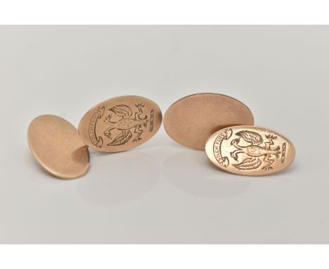 A PAIR OF YELLOW METAL CUFFLINKS, oval cufflinks engraved with a double headed phoenix inscribed 'Solem Fero',  other link pl
