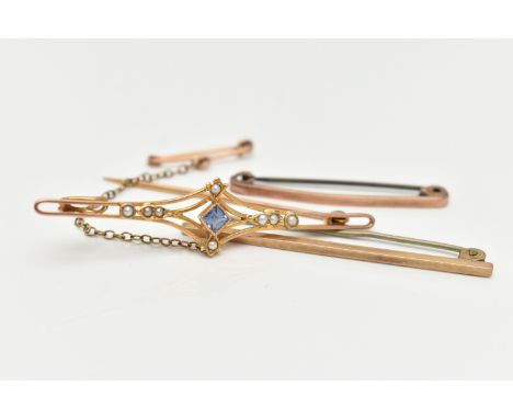 THREE YELLOW METAL BROOCHES, the first an open work brooch set with a central square cut topaz, with split pearl detail, fitt