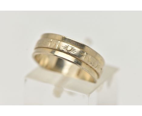 A WHITE METAL WIDE BAND RING, decorated with an engraved central band, approximate band width 5.7mm, stamped 750, 40 AR, ring