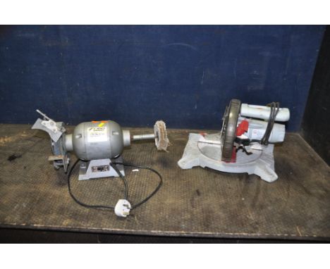 A PERFORMANCE POWER MITRE SAW and a Hilka 6in bench grinder with a grinding disc and a polishing mop fitted (both PAT pass an