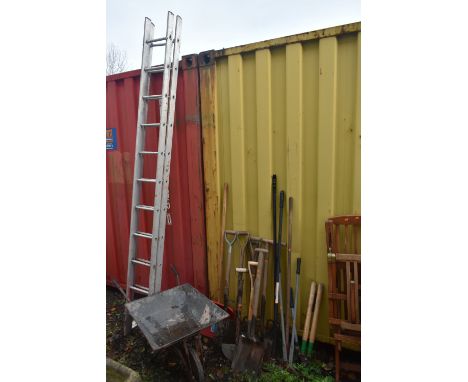 A SELECTION OF VINTAGE AND NEW GARDEN HAND TOOLS, to include spades, shovels, rakes, etc, along with a galvanised wheelbarrow