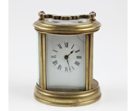 A brass carriage clock with one panel missing. BOOK A VIEWING TIME SLOT ON OUR WEBSITE FOR THIS LOT. IMPORTANT: Online biddin