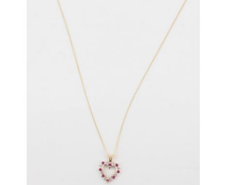 A ruby and diamond heart pendant, set with alternating ruby and diamond accents in open metalwork design, stamped 10k, on bel