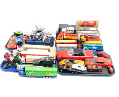 A group of diecast vehicles, play worn, to include trucks, flat bed trolleys, Ringos, Tesco truck, Woolworths. Poundland, Wee