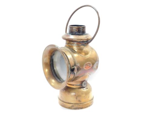 An early 20thC Belsize 104 brass car side lamp, 33cm high.