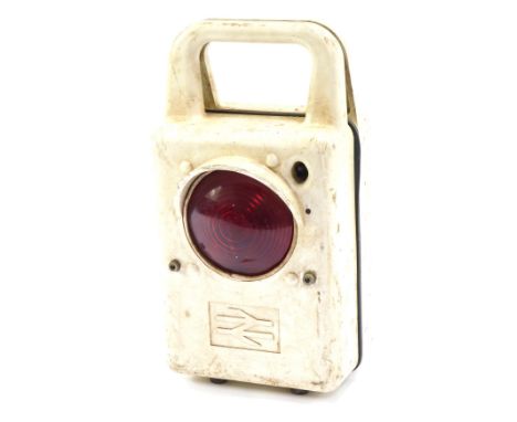 A railway carrying inspection lamp, in white Bakelite case with modern British Rail symbol, 41cm high, 19cm wide.