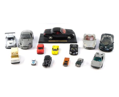 A group of diecast vehicles, to include the Beanstalk Group Aston Martin Vanquish, ambulance, Maisto Porsche Boxster, Motorma