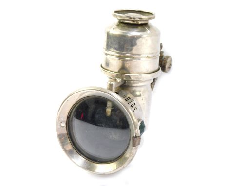 A multicar lamp, with a circular front with green and red jewelled sides on a chrome casing, 17cm high.