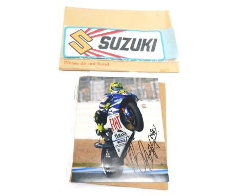 Motorbike racing interest, comprising a Valentino Rossi coloured photograph bearing biro signature, with Capital Autographs U