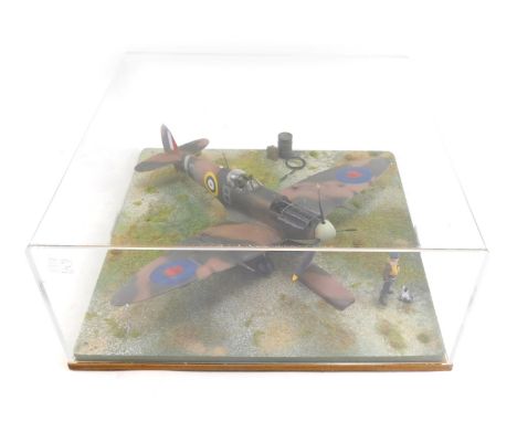 A diorama model of a Spitfire MKV, 1:32 scale, in perspex display case, 34cm high, 43cm wide, 43cm deep.
