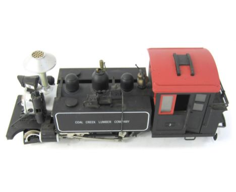 A Bachmann coal creek G scale locomotive, in black.