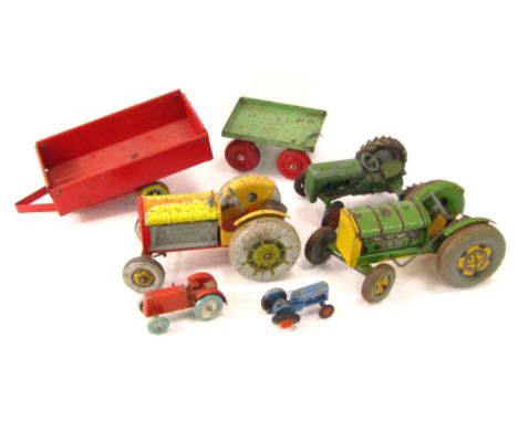 Tin plate agricultural vehicles, comprising a Mettoy clockwork green tractor and Mettoy clockwork yellow tractor, a diecast p