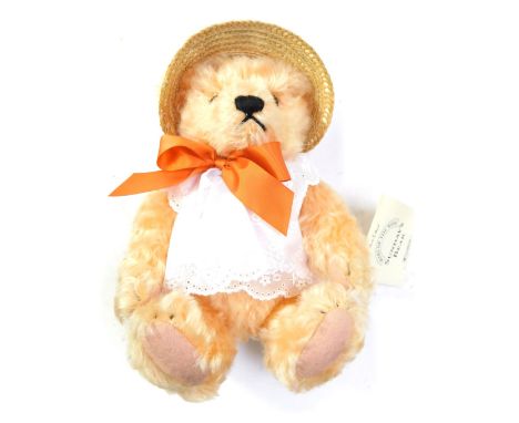 A Steiff pink Teddy Bear, with bow and sun hat, part of Danbury Mint Sunday Bears range, with tag.