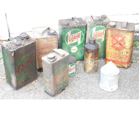 A group of Castrol and other oil cans, green vintage Castrol cans, yellow Gasoline and others. 