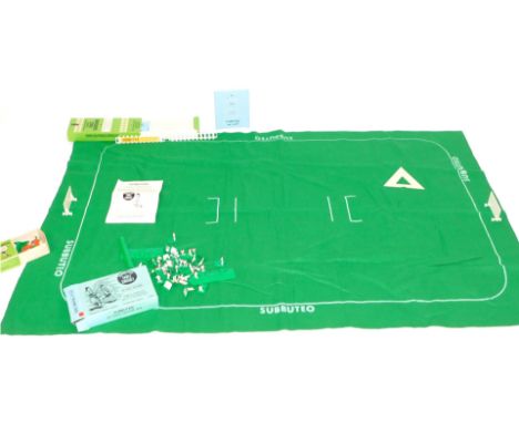 A Subbuteo table cricket set, comprising plastic fence surround, Subbuteo throw in figures and a Subbuteo table cricket score