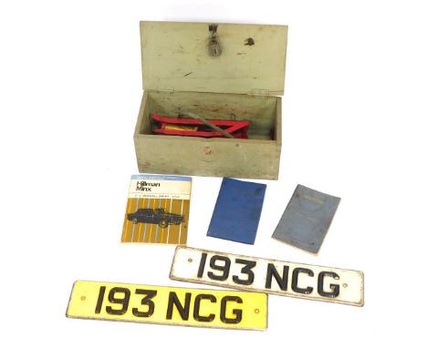 A group of automobilia, comprising a wooden trunk, two vintage number plates for 193 NCG, a foot pump, Pearsons Illustrated C