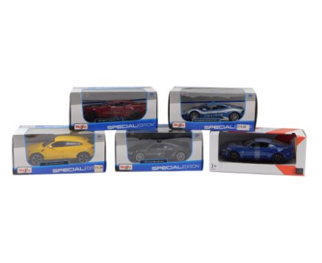 A group of diecast vehicles, 1:24 scale, comprising Maisto Lamborghini Hurricane LP610-4, John Lewis McLaren, Maisto Audi R8 