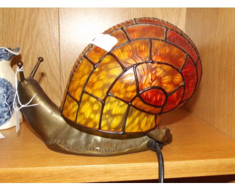 Table lamp in the form of a snail