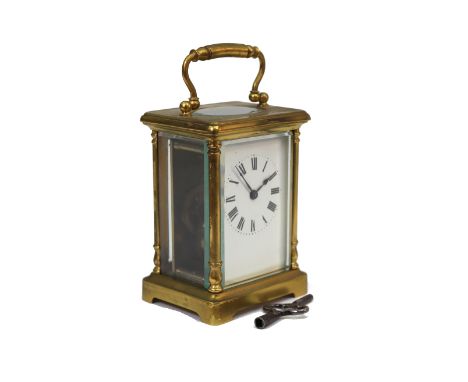 A French brass cased carriage timepiece, the white enamel dial with Roman numerals, 11cm high.