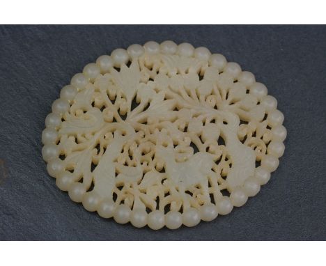 A vintage oriental carved jade panel, carved with woodland scene. 