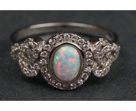 Silver and CZ ring with central opal panel 