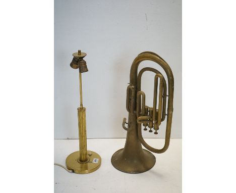 A brass corinthian column table lamp together with a brass tuba. 